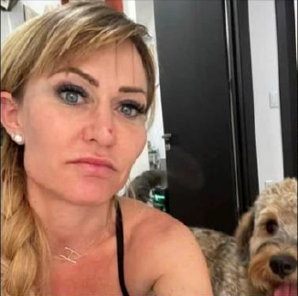 Heidi Sue Planck and her labradoodle